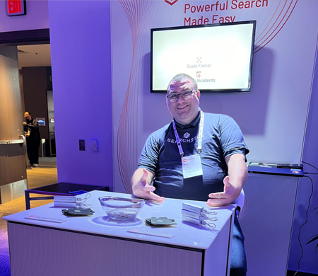 A SearchStax team member in exhibition booth