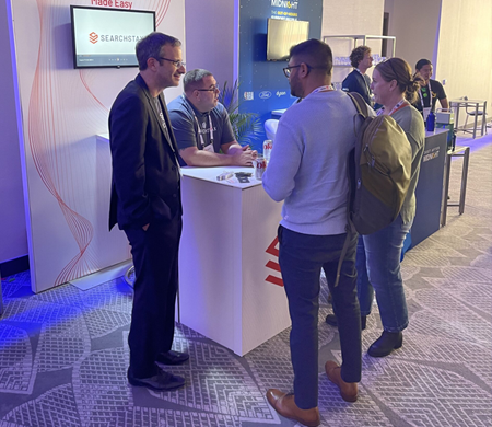 SearchStax representatives presenting services at an exhibition