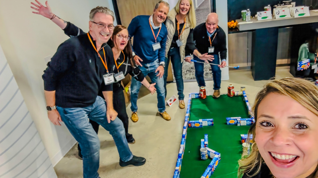 SearchStax team members participating in a fun indoor team-building game during a company event