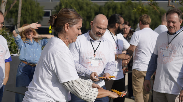 SearchStax employees enjoying play time in the office garden