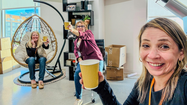 Employees enjoying a coffee break together in the SearchStax office