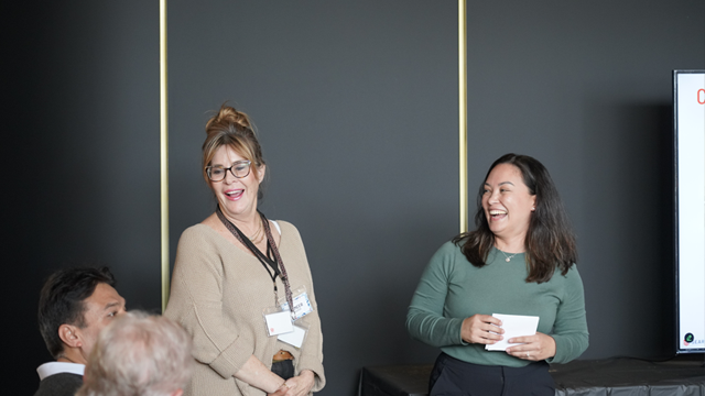 SearchStax staff participating in a group discussion during an indoor company event
